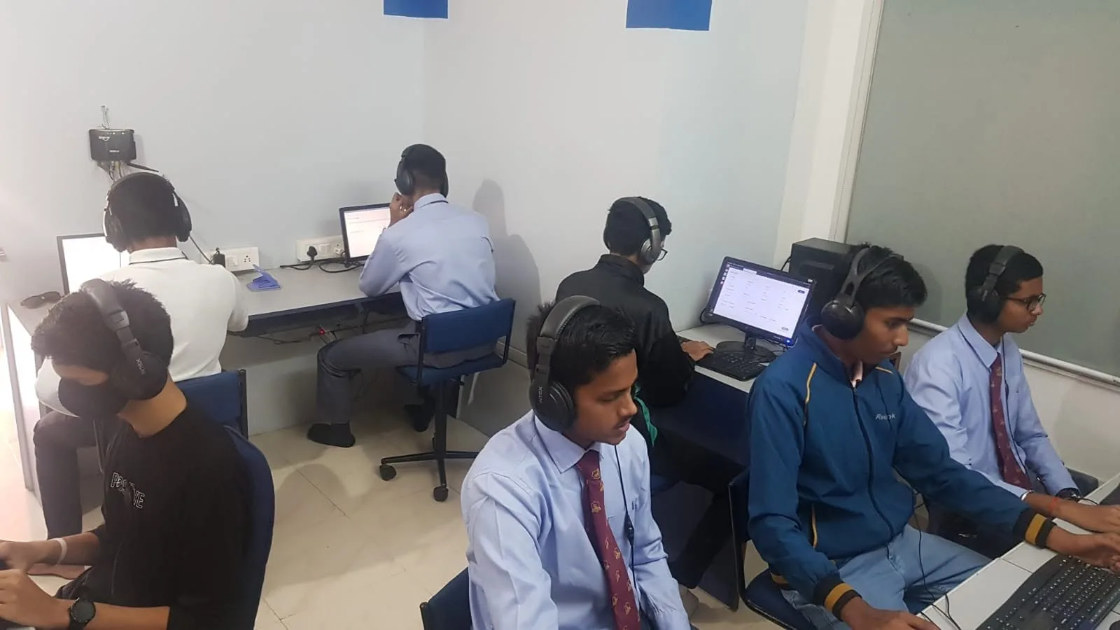 Students taking a computer-based NDA mock test